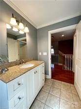 bathroom featuring vanity, tile patterned floors, and ornamental molding