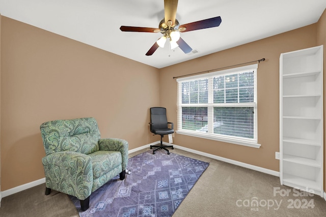 living area with ceiling fan and carpet floors