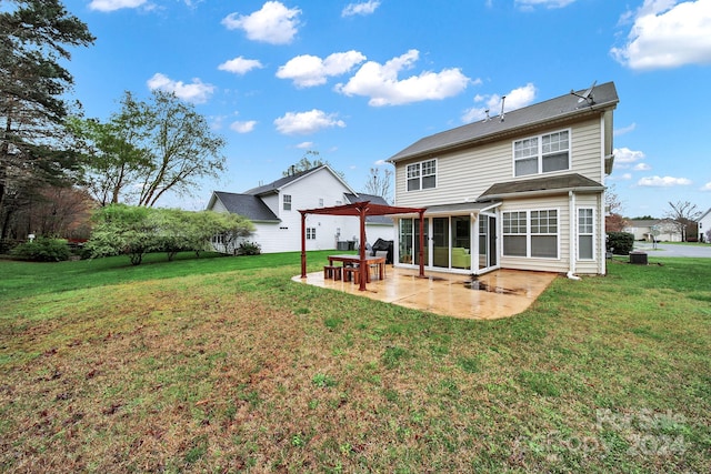 rear view of property with a lawn, a pergola, and a patio