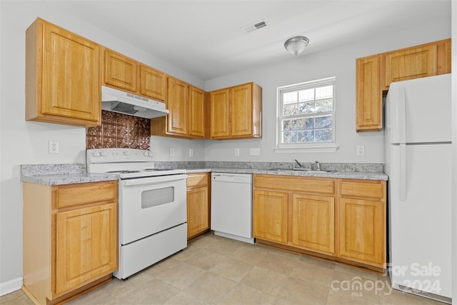 kitchen with sink and white appliances