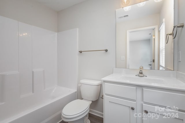 full bathroom with vanity,  shower combination, and toilet