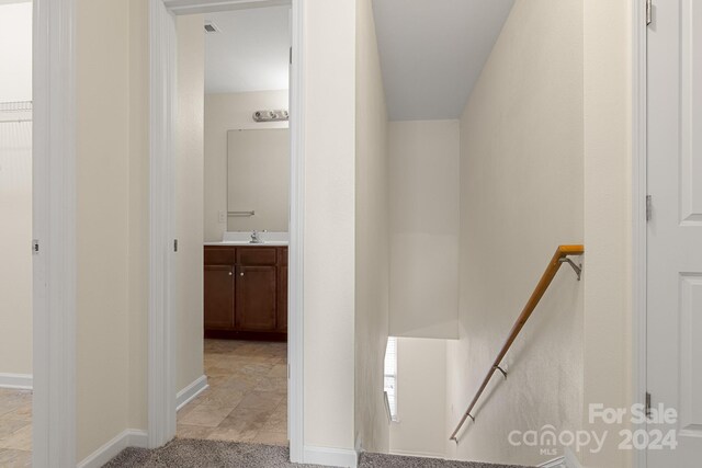 hallway featuring sink