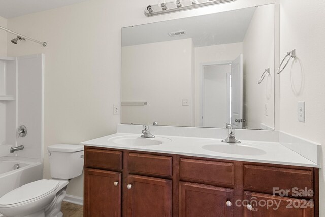 full bathroom with vanity, shower / bath combination, and toilet