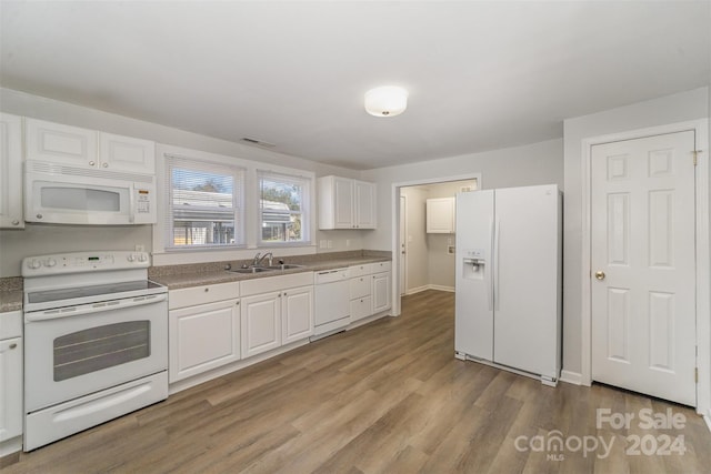 kitchen with white cabinetry, light wood-type flooring, white appliances, and sink