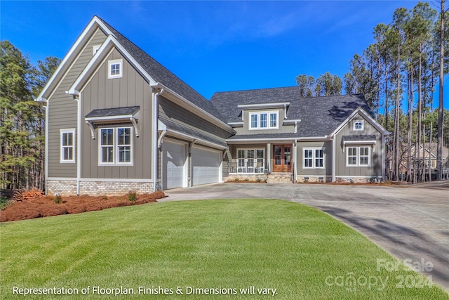 craftsman house featuring covered porch, a front yard, and a garage