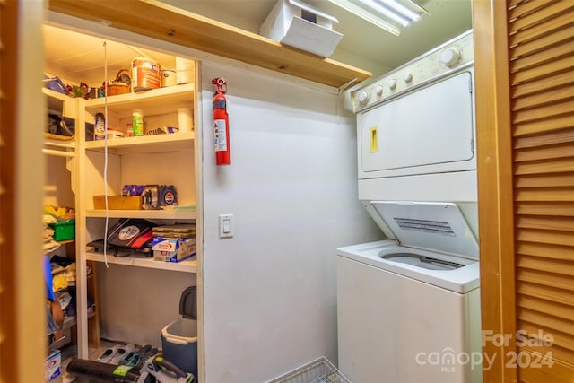 laundry area featuring stacked washer and dryer