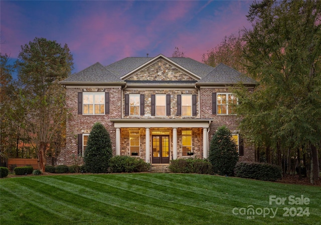 view of front of home with a lawn