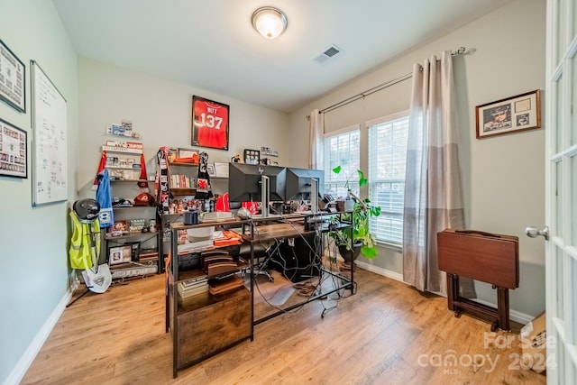 office with light hardwood / wood-style floors