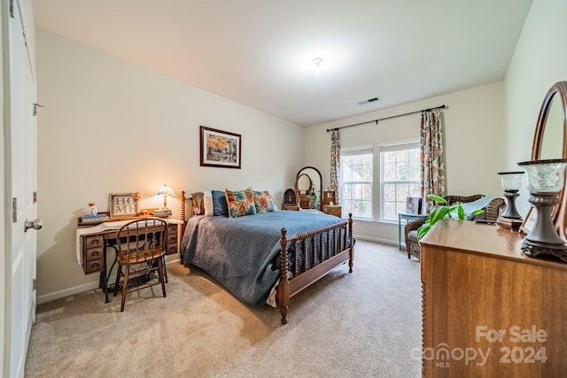 bedroom with light colored carpet