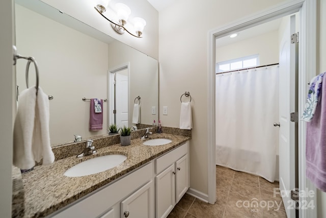 bathroom with vanity and walk in shower