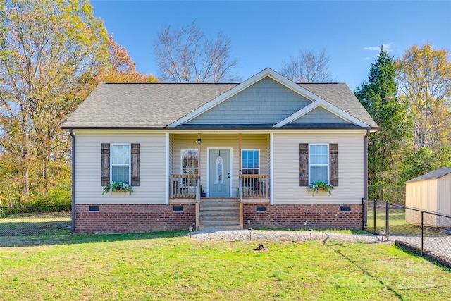 view of front facade with a front lawn and covered porch