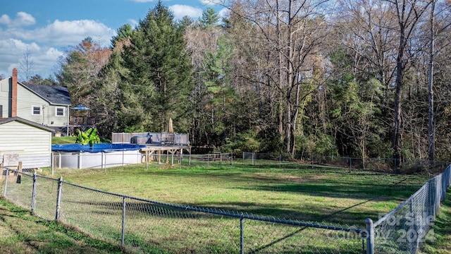 view of yard featuring a covered pool