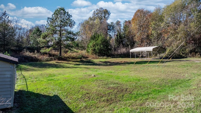 view of yard with a carport