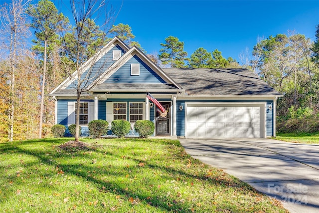 view of front facade with a garage and a front yard