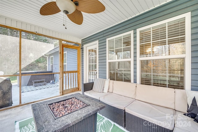 unfurnished sunroom featuring ceiling fan and wooden ceiling