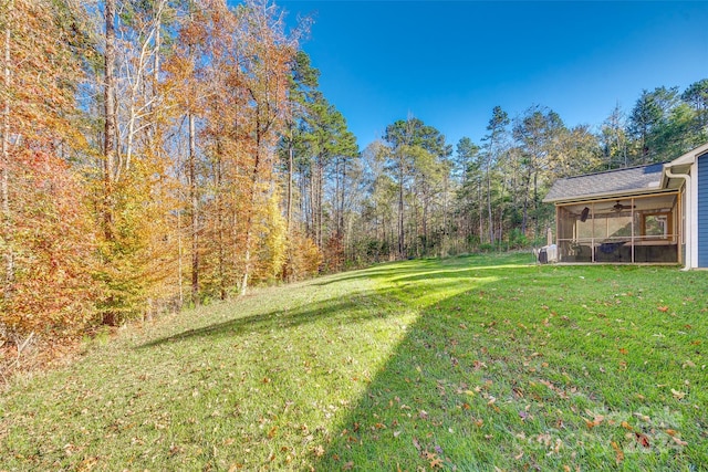 view of yard featuring a sunroom