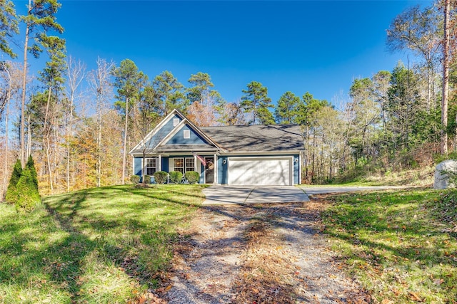 view of front of property featuring a front yard and a garage