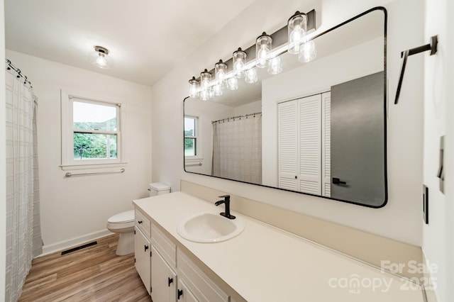 2109 Rock Springs Cir, Denver, NC 28037 - full bath featuring toilet, vanity, baseboards, and wood finished floors