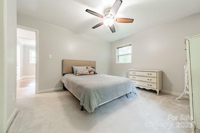 2109 Rock Springs Cir, Denver, NC 28037 - bedroom featuring light carpet, baseboards, and a ceiling fan