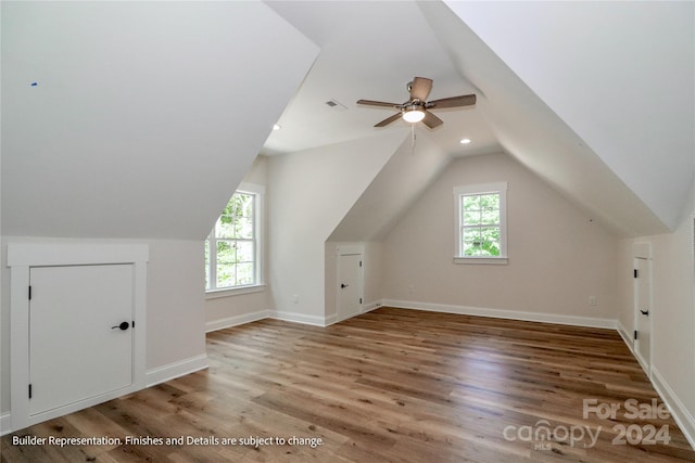 bonus room with ceiling fan, hardwood / wood-style floors, and vaulted ceiling