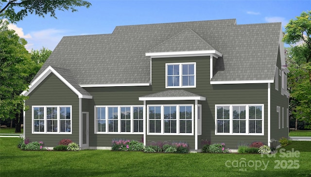 back of house with a yard and a shingled roof