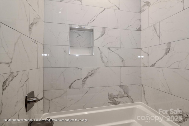 bathroom with tub / shower combination