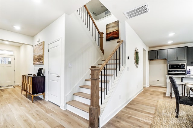 stairway with wood-type flooring