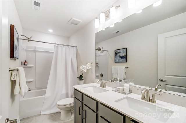 full bathroom with shower / bath combo, vanity, and toilet