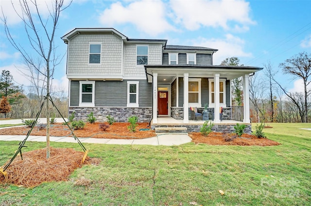 view of front facade featuring a front yard and a porch