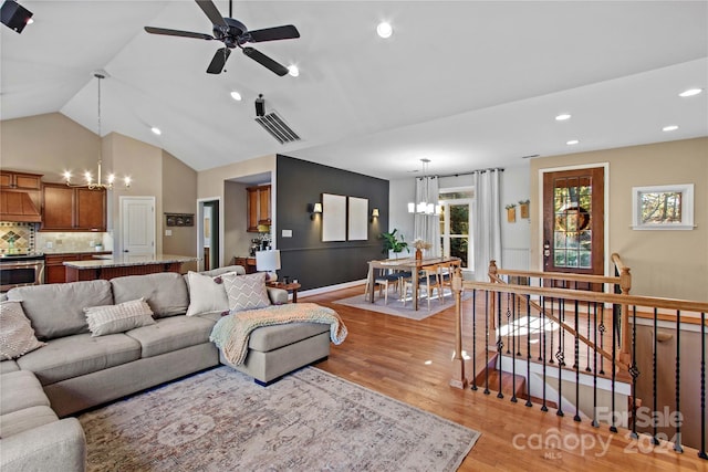 169 Rimmer Farm Rd, Troutman, NC 28166 - living area featuring a chandelier, light wood-style flooring, ceiling fan, recessed lighting, and lofted ceiling