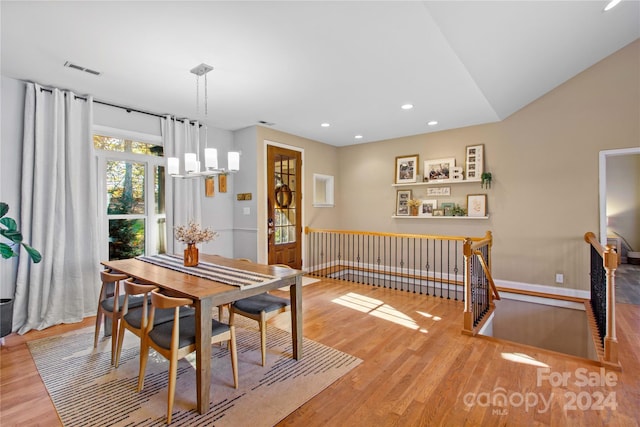 169 Rimmer Farm Rd, Troutman, NC 28166 - dining room with wood finished floors, a chandelier, recessed lighting, and baseboards
