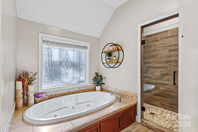 169 Rimmer Farm Rd, Troutman, NC 28166 - bathroom with vaulted ceiling, a stall shower, and a whirlpool tub