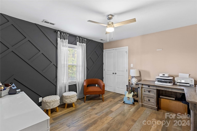 169 Rimmer Farm Rd, Troutman, NC 28166 - office with light wood-style flooring, ceiling fan, and a decorative wall