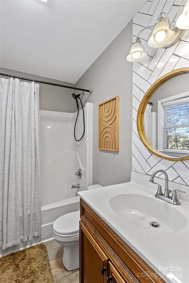 169 Rimmer Farm Rd, Troutman, NC 28166 - full bath with vanity, toilet, shower / tub combo, wood finished floors, and tasteful backsplash