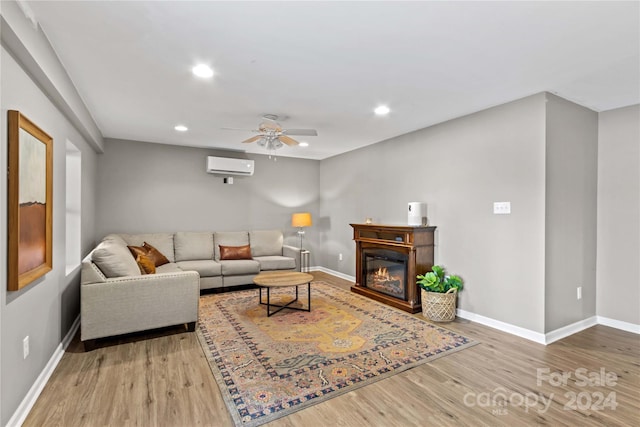 169 Rimmer Farm Rd, Troutman, NC 28166 - living area with a wall unit AC, a ceiling fan, wood finished floors, baseboards, and recessed lighting