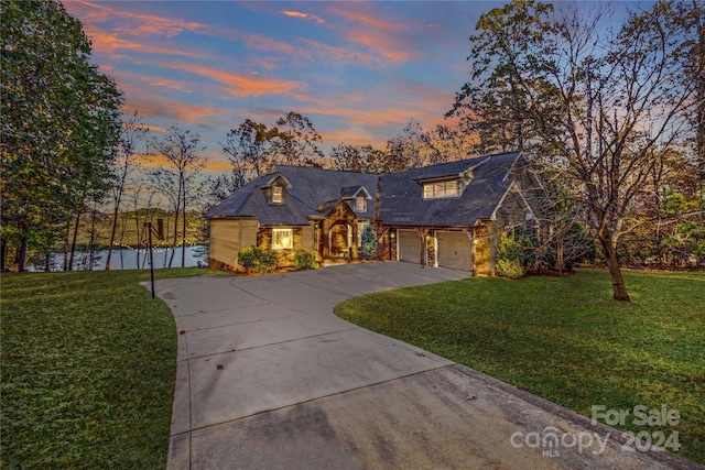 169 Rimmer Farm Rd, Troutman, NC 28166 - view of front facade with driveway, a yard, a garage, and stone siding