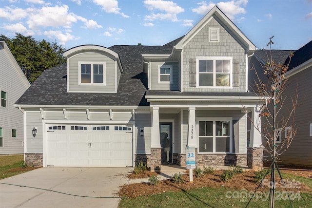 craftsman inspired home featuring covered porch