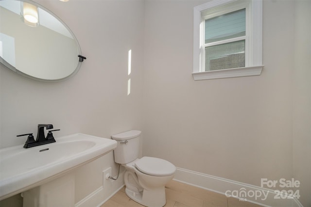 bathroom with toilet and sink