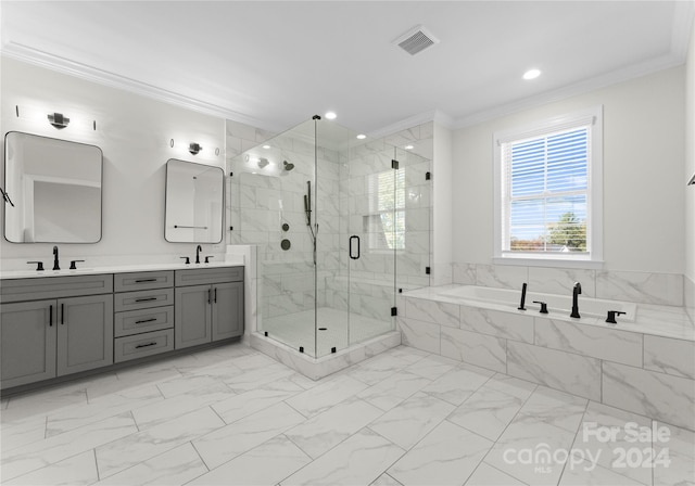 bathroom featuring crown molding, vanity, and independent shower and bath