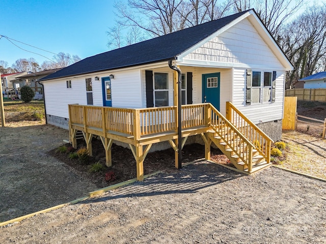 view of front of house featuring covered porch and a deck