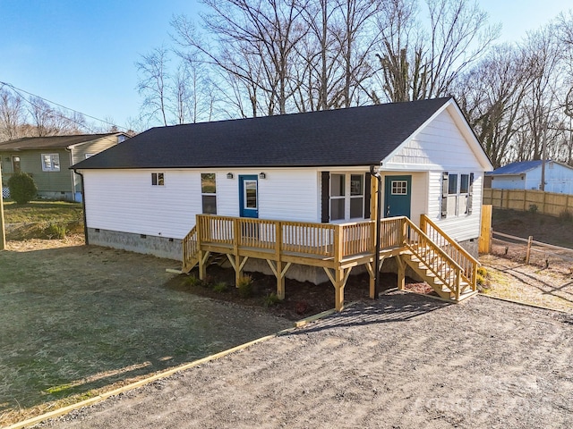 view of front of house featuring a wooden deck