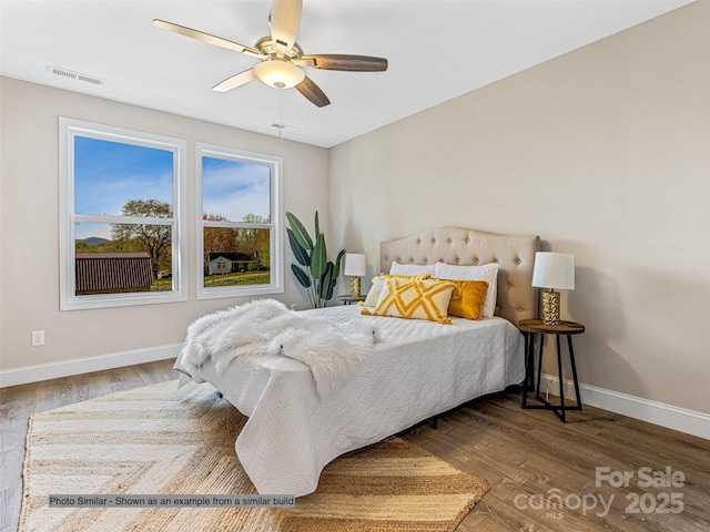 bedroom with hardwood / wood-style flooring and ceiling fan