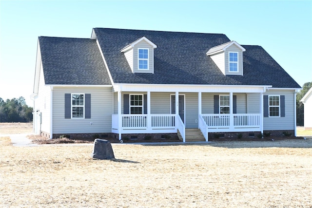 cape cod-style house with a porch