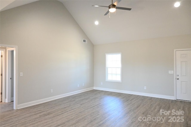 unfurnished room with high vaulted ceiling, wood-type flooring, and ceiling fan