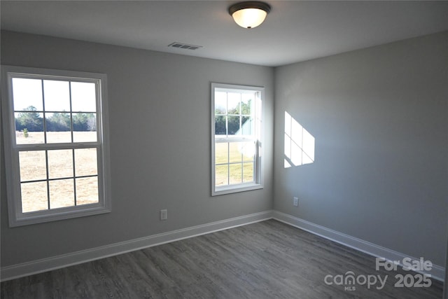 empty room featuring dark hardwood / wood-style floors