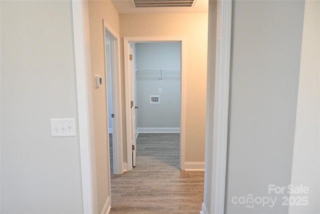 hallway featuring hardwood / wood-style flooring