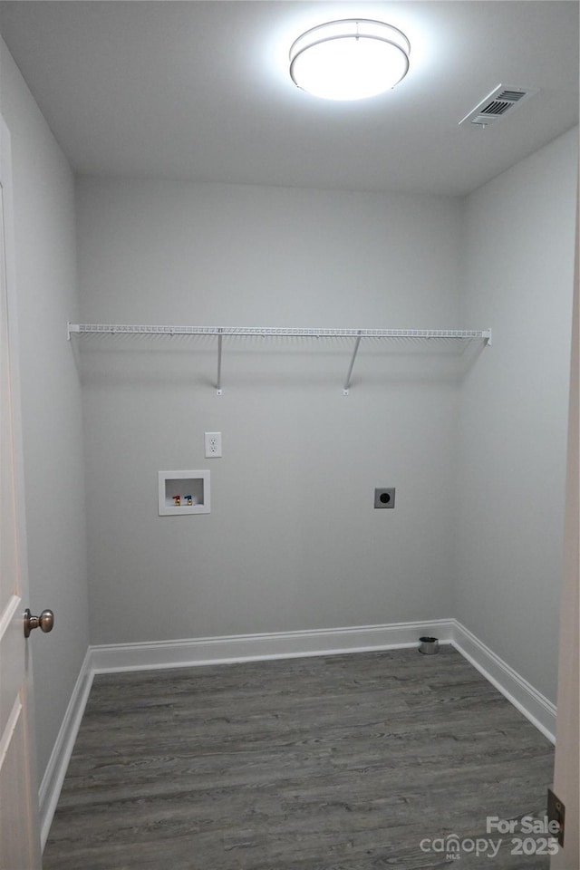 laundry area featuring washer hookup, electric dryer hookup, and dark wood-type flooring