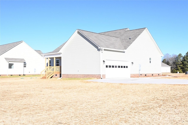 view of side of home featuring a garage