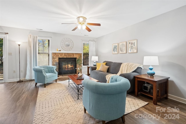 living room with hardwood / wood-style flooring and ceiling fan