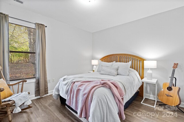 bedroom featuring dark hardwood / wood-style floors